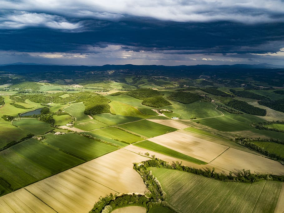 green grass field under white clouds, aerial view of grass and soil covered field during day HD wallpaper