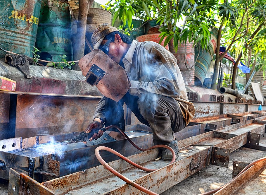 man holding welding mask, container drums, craft, dirty, heat HD wallpaper