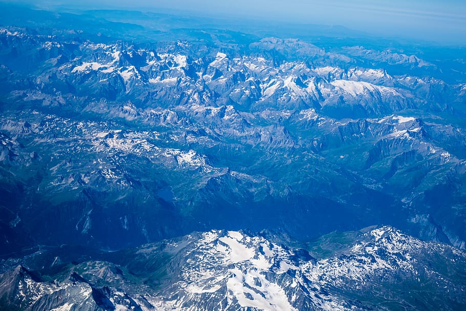 aerial photo of snow covered mountains, aerial photography of mountains at daytime