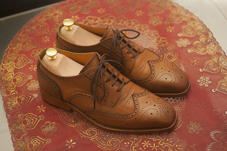 pair of brown brogues, wingtip, dress shoes, leather shoes, full grain