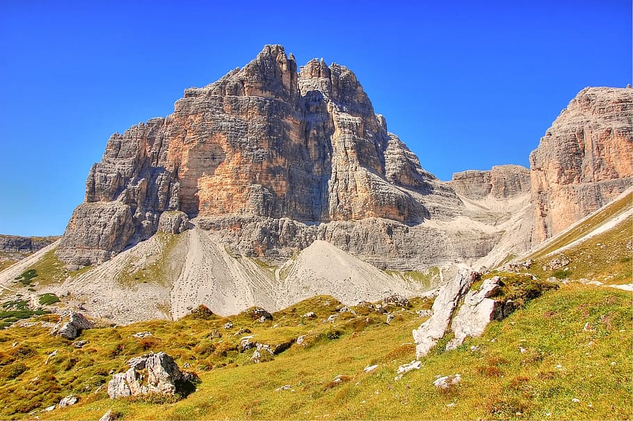 landscape photo of brown mountain near field, sesto, dolomites