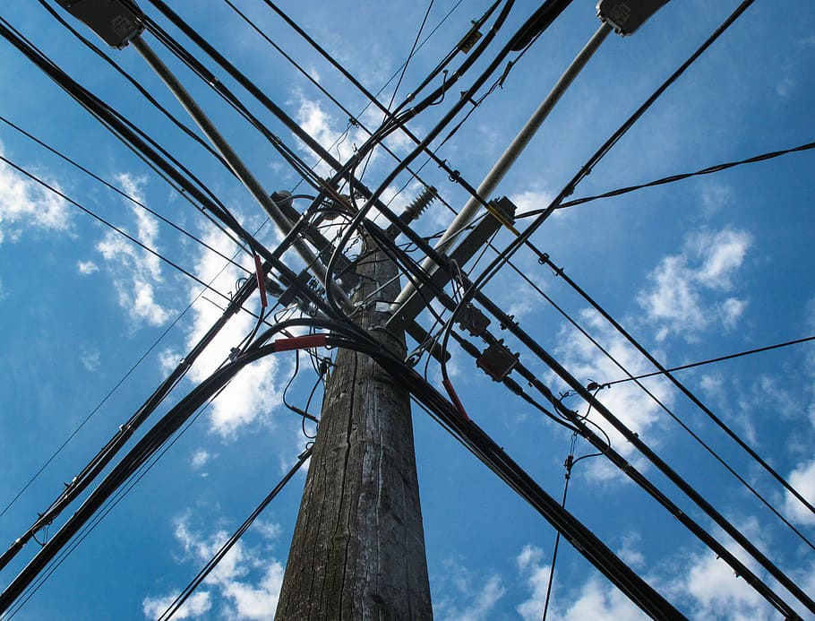 low angle photo of electric post with cables, low angle photo of gray and black transmission tower HD wallpaper