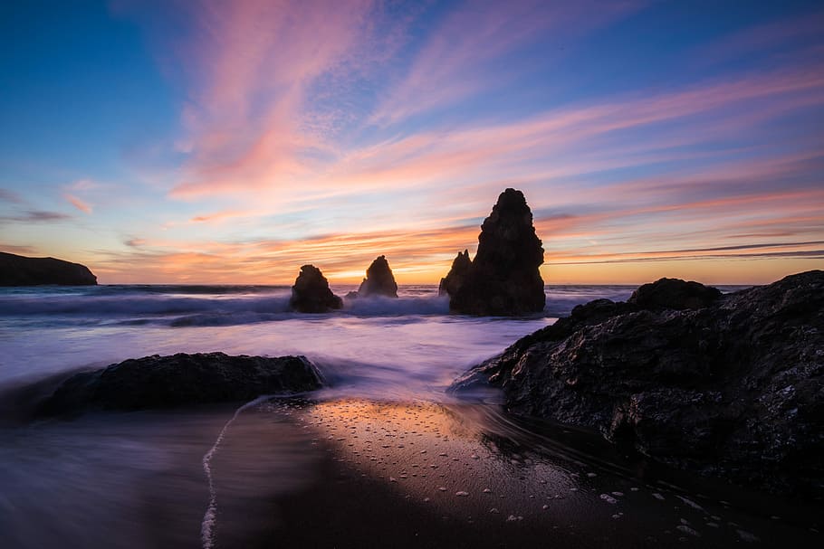 rock monument beside water with cloudy sky, time lapse photography of seashore during golden hour HD wallpaper
