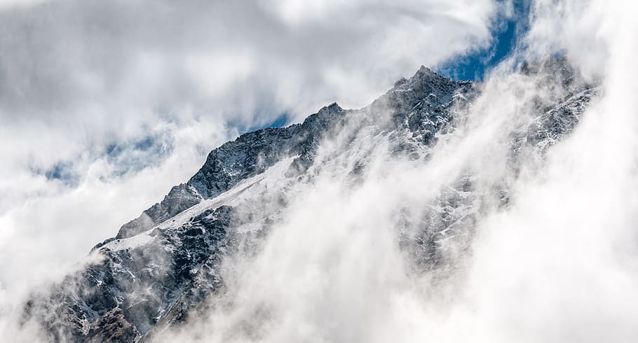 snowy mountain covered with fogs, mountains covered by clouds HD wallpaper
