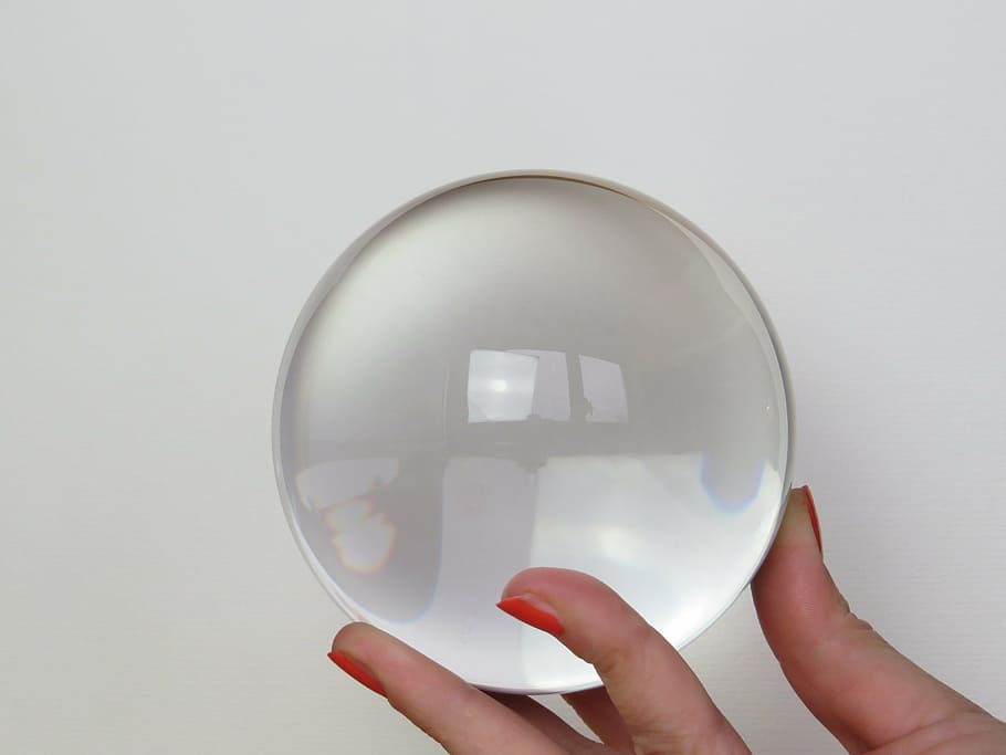 person holding a clear glass ball, fortune telling, place cards