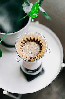 clear glass drinking cup and saucer, clear glass cup filled with brown liquid HD wallpaper