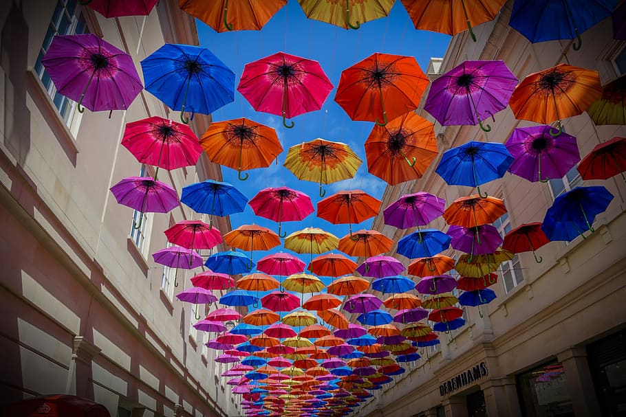 low-angle shot photography of umbrellas between buildings, creative HD wallpaper