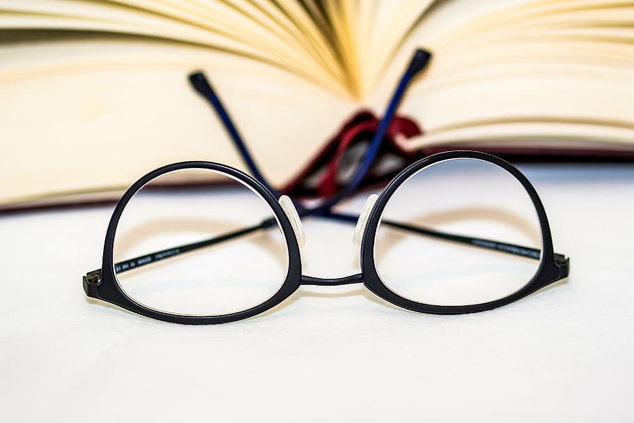 selective focus photo of black framed eyeglasses, lenses, reading glasses