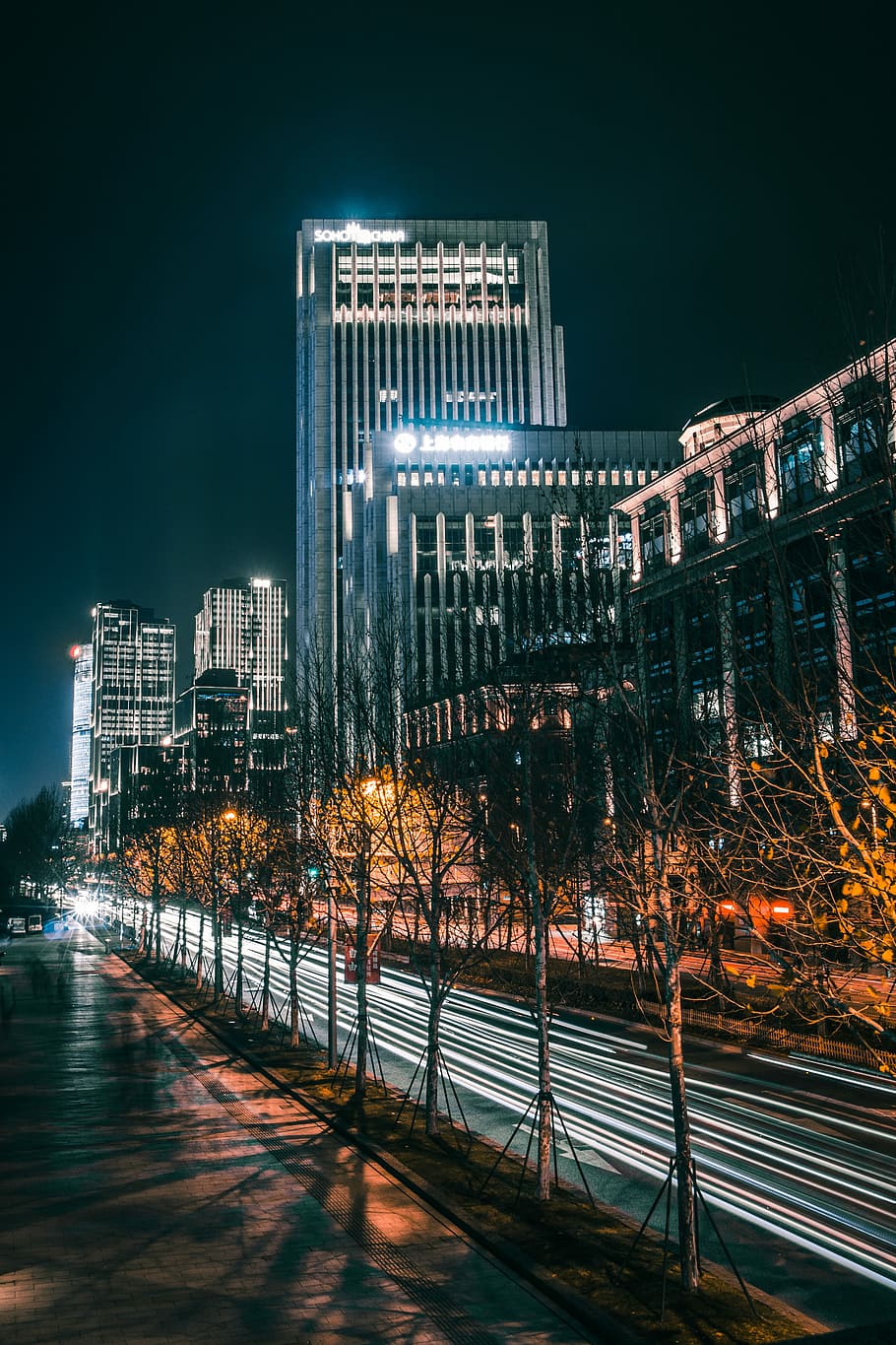 time lapse photography of road, time-lapse photography of vehicle passing through the road near buildings and trees during night time HD wallpaper