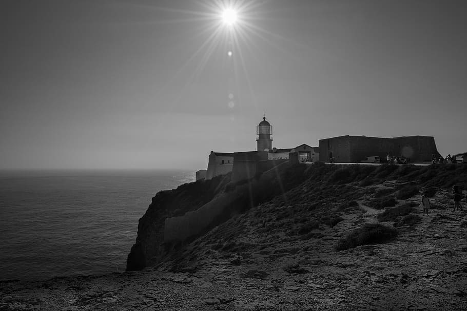 lighthouse, beacon, cliff, coast, ocean, shore, sun, landscape HD wallpaper