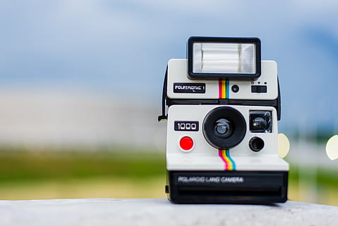 selective focus photo of white and black Polaroid land camera close up photo HD wallpaper