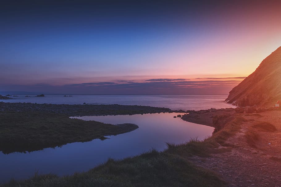 Sunset landscape shot taken at Duckpool Beach in Cornwall, England HD wallpaper