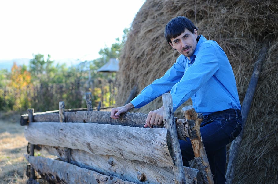 Haystack, Man, Male, Fence, blue shirt, jeans, waiting, one person HD wallpaper