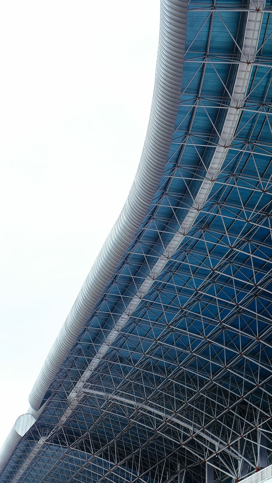 architectural photo of gray and blue metal building, gray metal building during daytime HD wallpaper