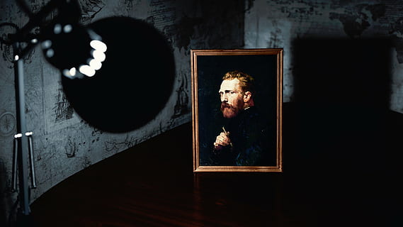 man wearing black coat painting with brown wooden frame near turned-on lamp HD wallpaper