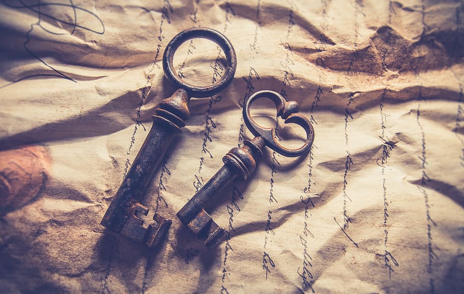 two skeleton keys on brown paper, vintage, old, background, retro
