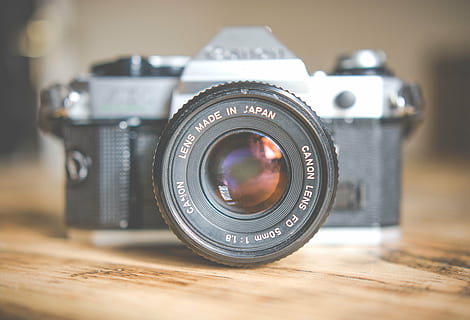 gray and black single-lens reflex camera on brown surface, canon HD wallpaper