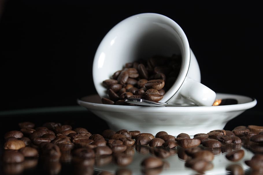 selective focus photo of white ceramic teacup on saucer with coffee beans HD wallpaper