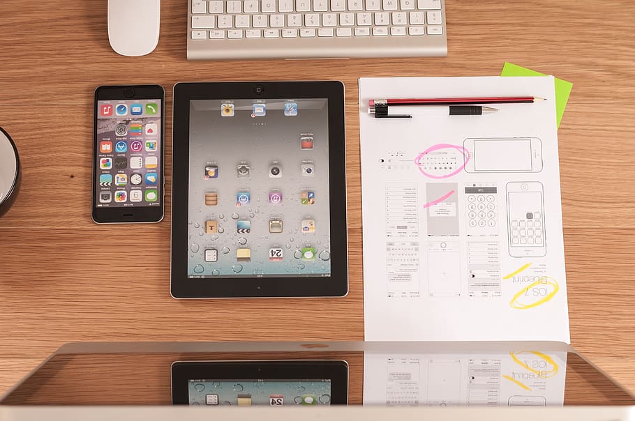 black iPad beside iPhone on brown wooden table, imac, apple HD wallpaper