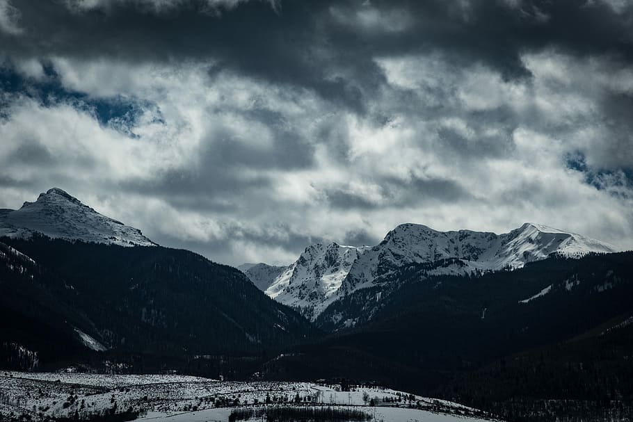 greyscale photography of mountains, white and black mountains under cloudy sky HD wallpaper