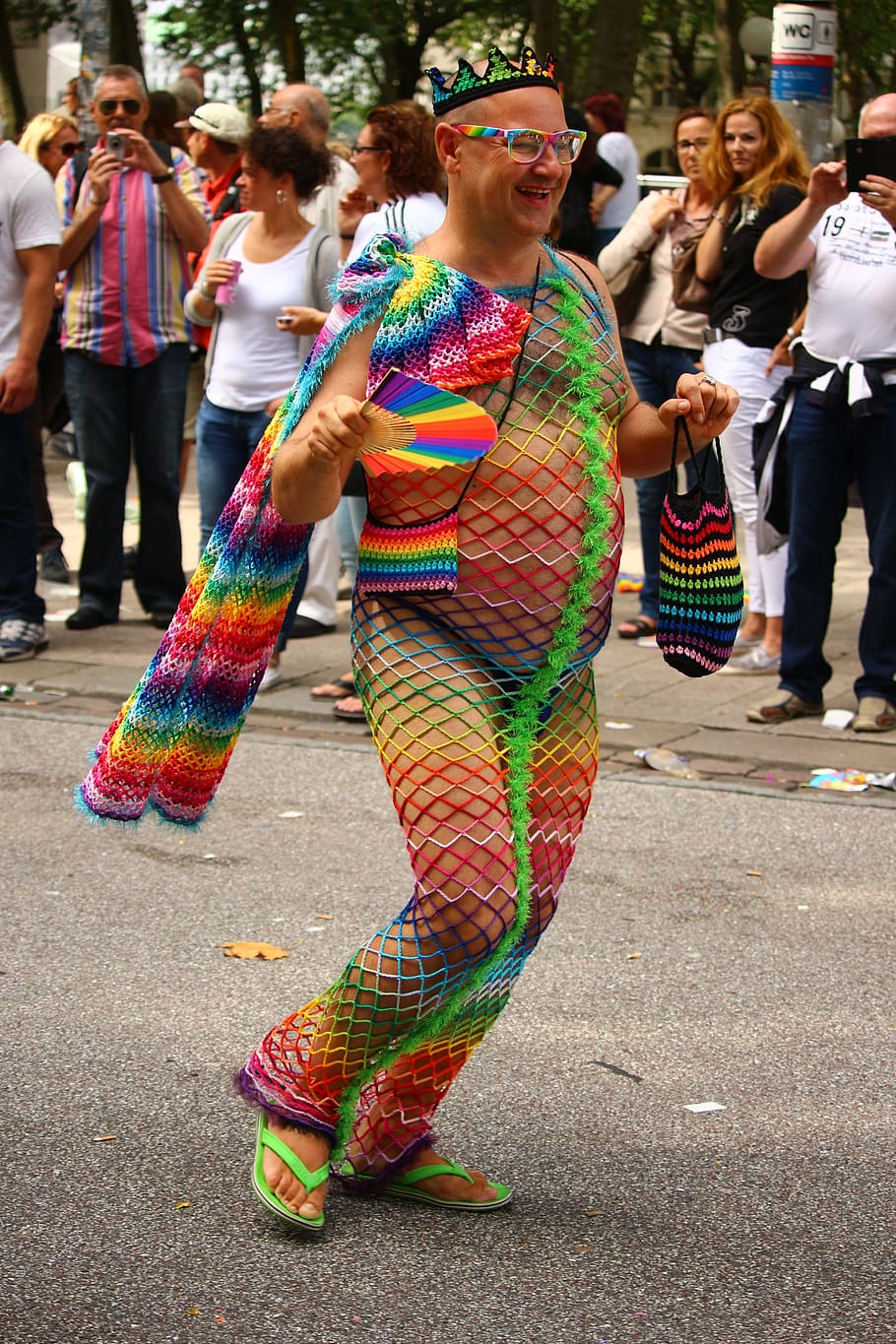 man wearing multicolored fishnet suit on street, csd, colorful