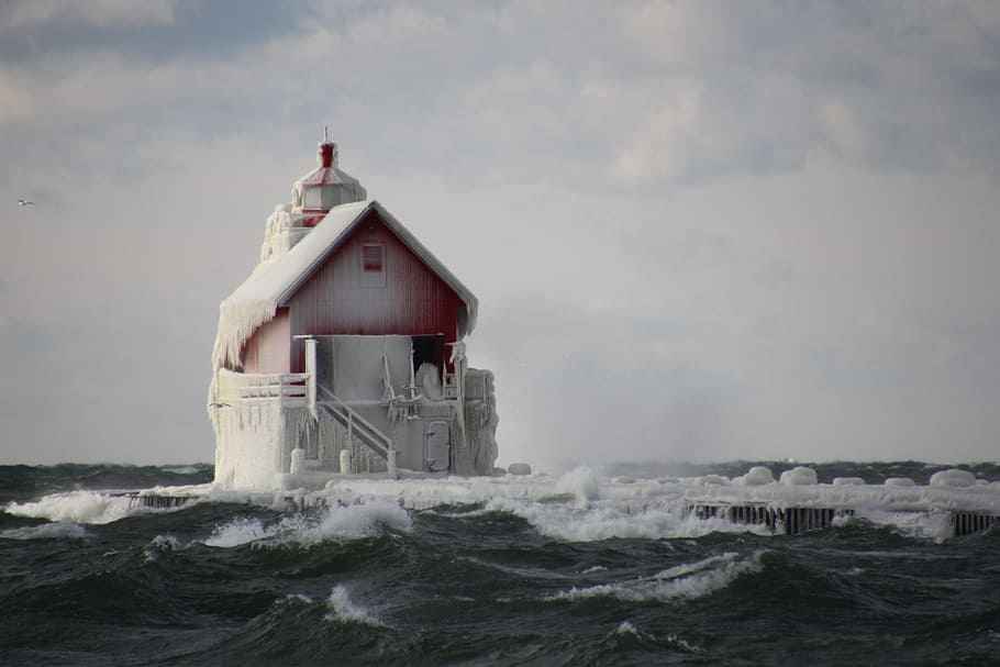 red structure covered snow in middle ocean, landscape photography red house surrounded with body of water HD wallpaper