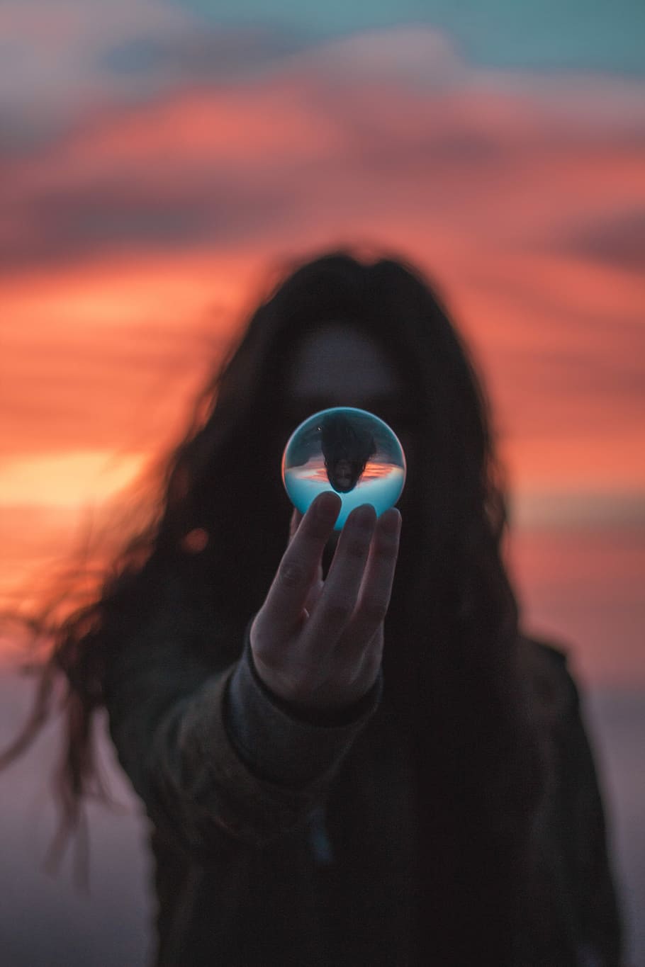 selective focus photography of woman holding ball, person holding ball with reflection HD wallpaper
