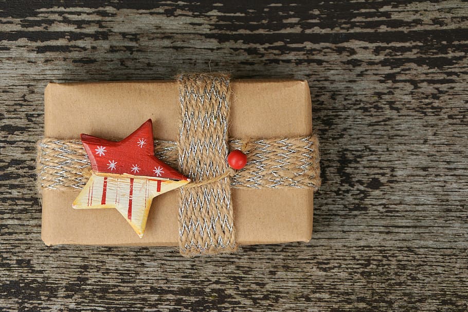 wrapped present with star accent bow, gift, gift parcel, christmas HD wallpaper
