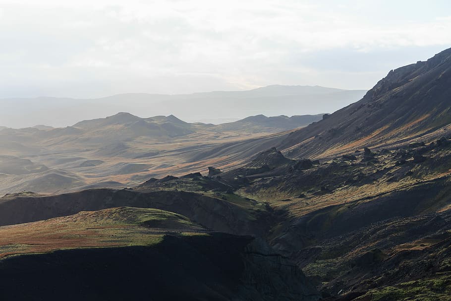 panoramic photography of mountain, brown and black mountains under white sky during daytime HD wallpaper