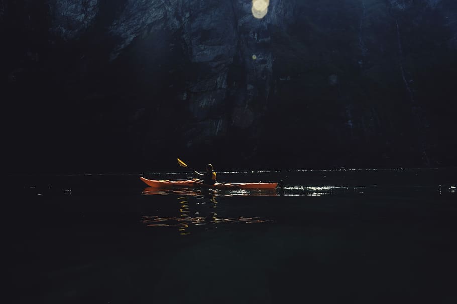 person riding on red kayak while paddling on body of water, untitled HD wallpaper