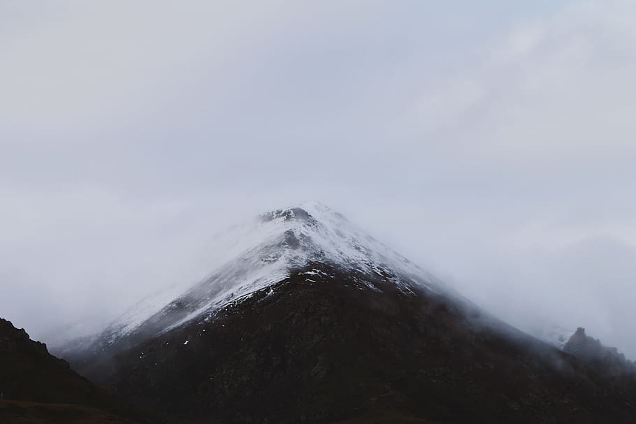 snow mountain summit under clouds, silhouette photo of mountain covered with fog HD wallpaper