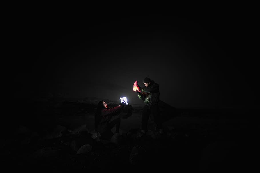 Fire and Ice, man holding shoe and light, night, moody, dark HD wallpaper