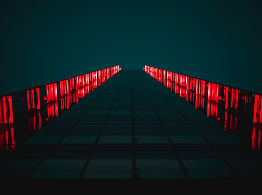 black pathway between red LED light rails, worm's eye view of glass building with red lights HD wallpaper