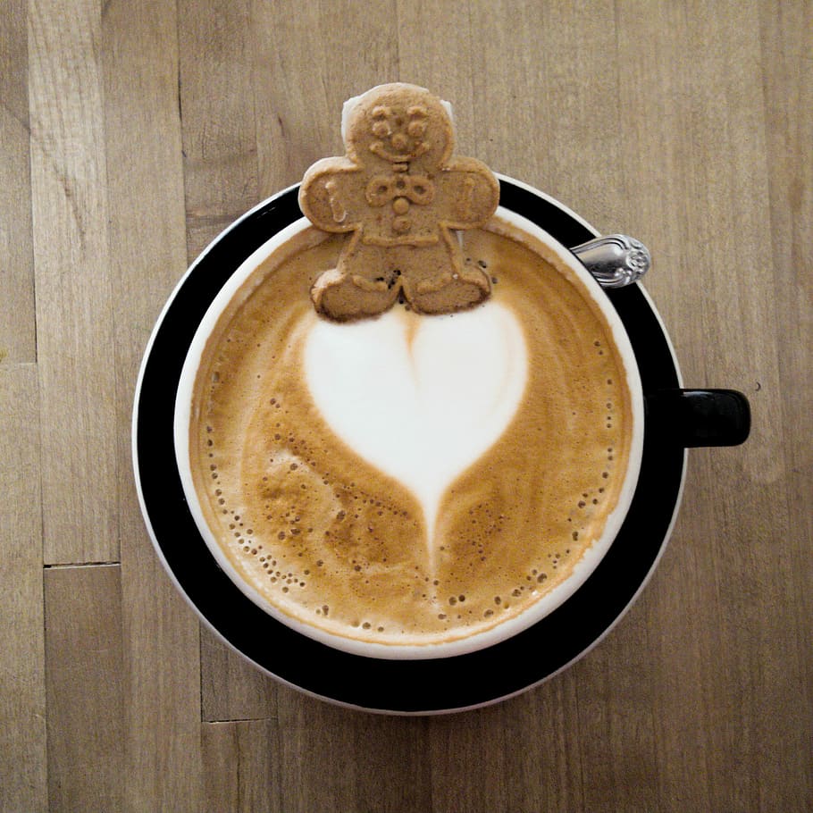 Cute gingerbread cookie floating on a latte heart at Kreuzberg, Ca. HD wallpaper