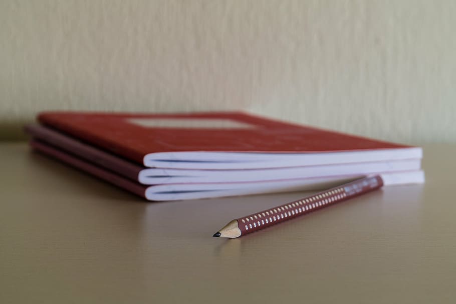 red and beige pencil beside three red notebooks, desk, school, HD wallpaper