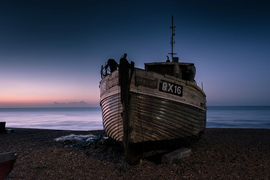 white and gray ship on sand near body of water under orange and gray sky, white sailing ship on dock HD wallpaper