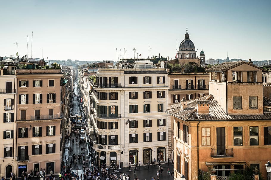 top view photography of divided buildings beside road near cathedral under white and blue skies, aerial photo of high-rise buildings HD wallpaper