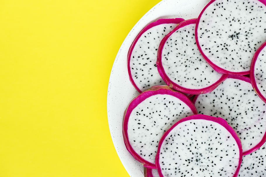 sliced dragon fruits on white plate, flatlay, monochrome, studio shot HD wallpaper