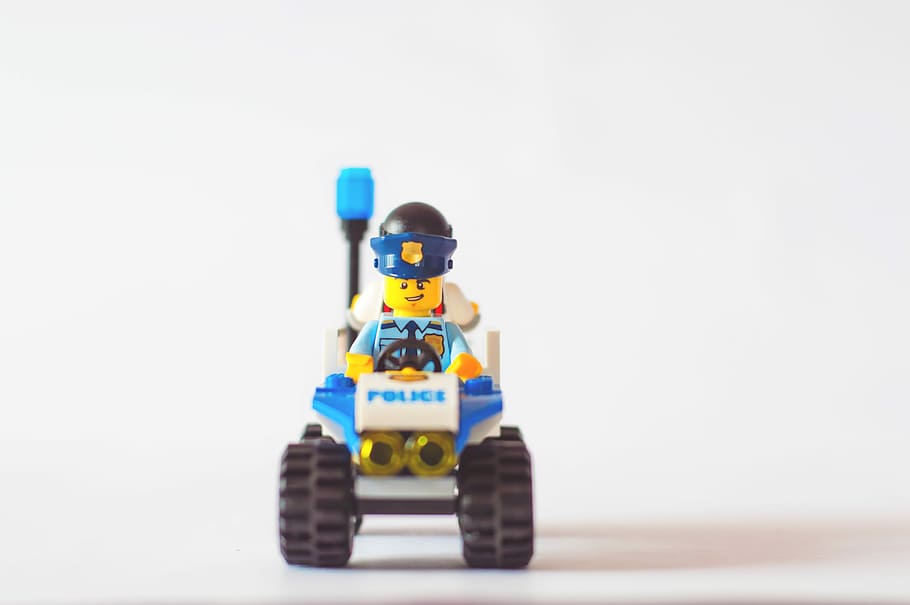 police minifigure, selective focus photo of Police LEGO minifig toy