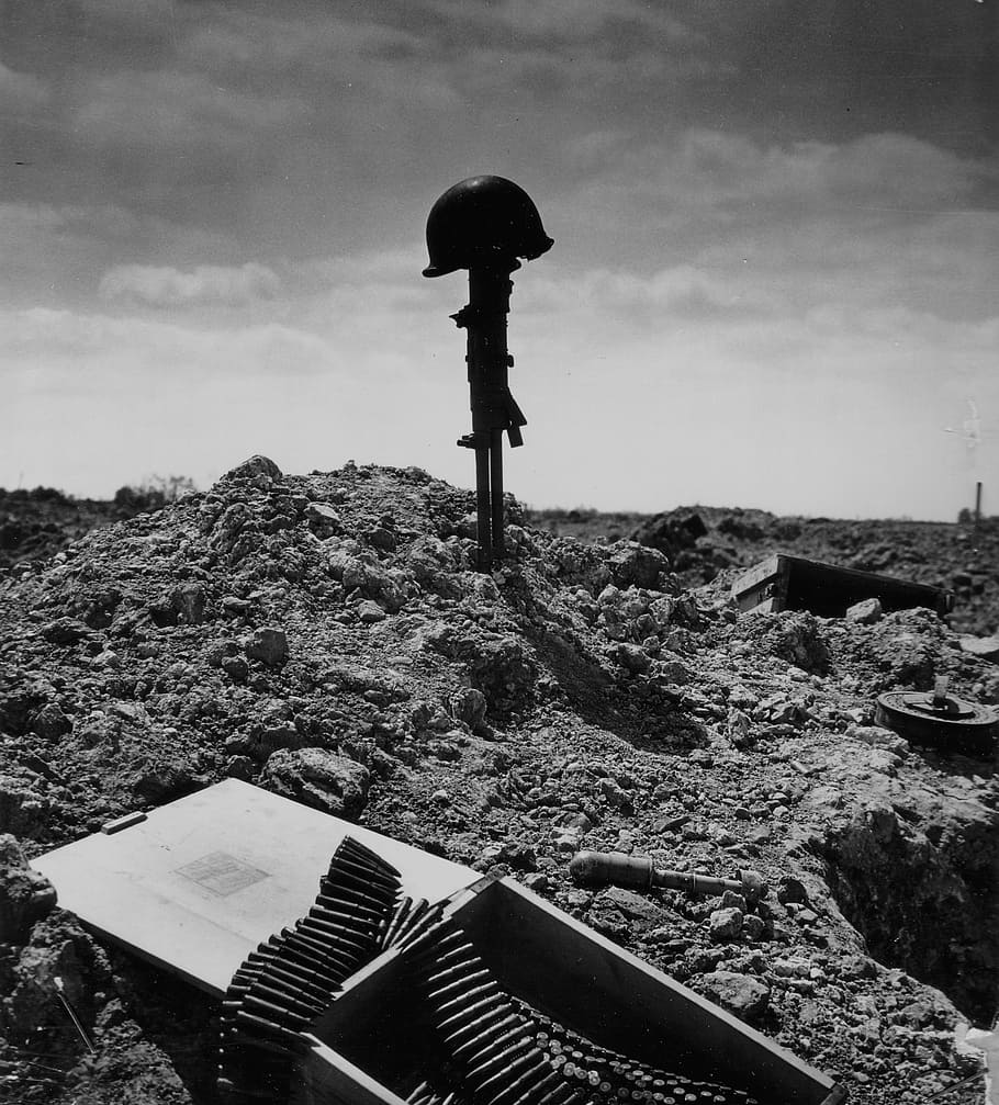 photo of soldier helmet and bullets, soldier's grave, war, buried