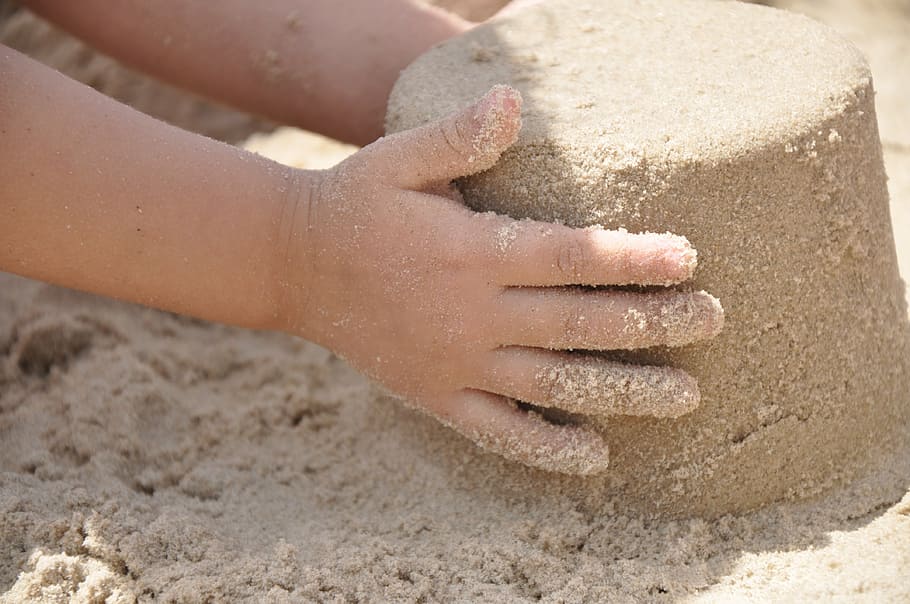 child holding pile of sand, hand, beach, summer, vacation, outdoor HD wallpaper