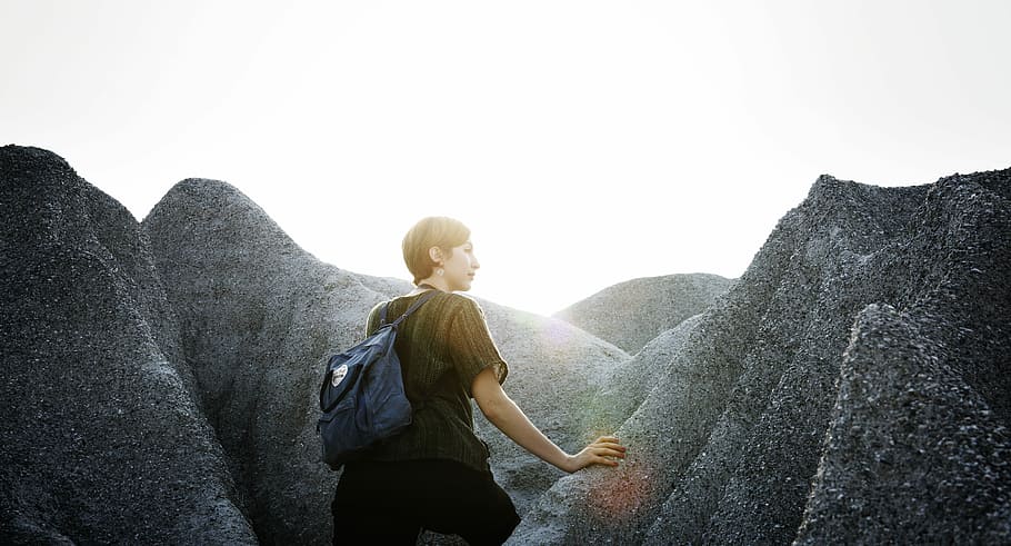woman standing on rock, mountain, sunlight, stone, boulder HD wallpaper