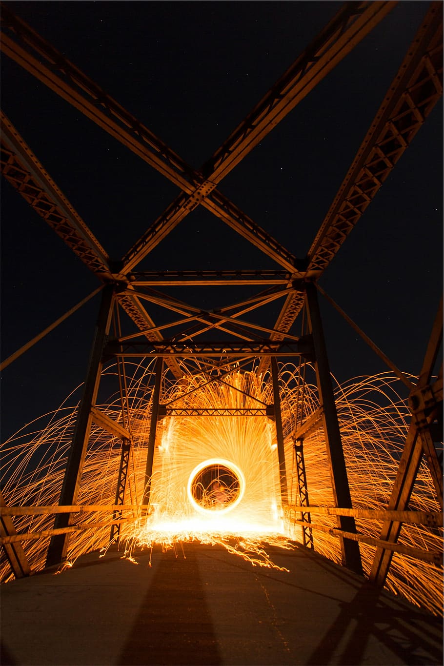 steel wool photography of light on bridge at nighttime, brown HD wallpaper