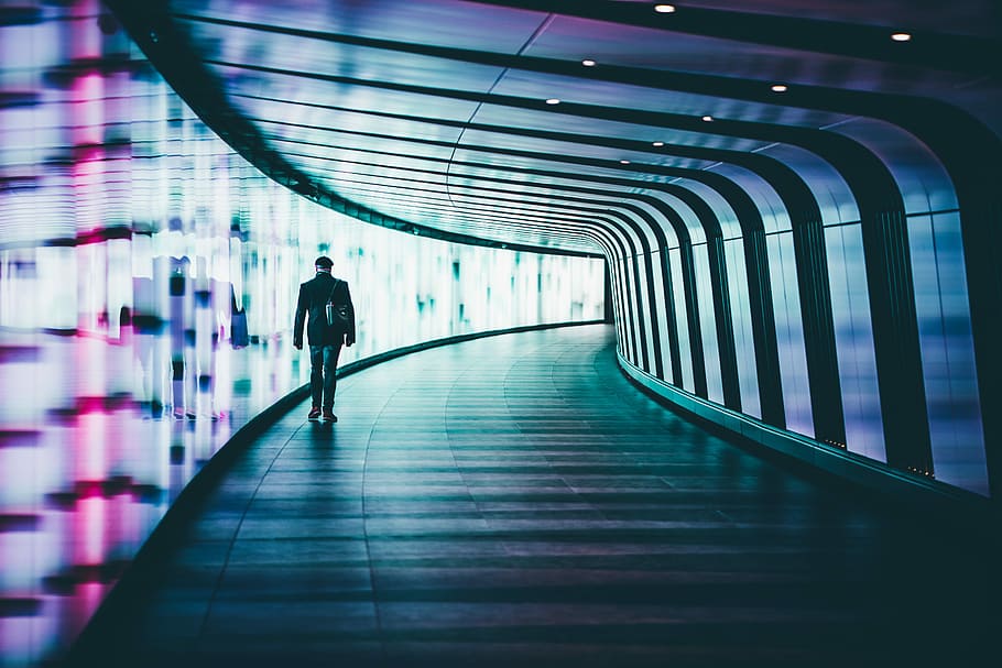 person walking along corridors ], person walking near multicolored wall HD wallpaper