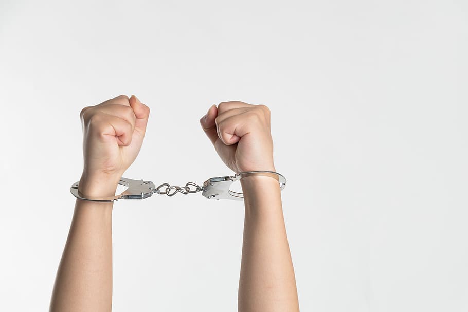 Handcuffed criminal, person wearing handcuffs, arms, arrest, fist