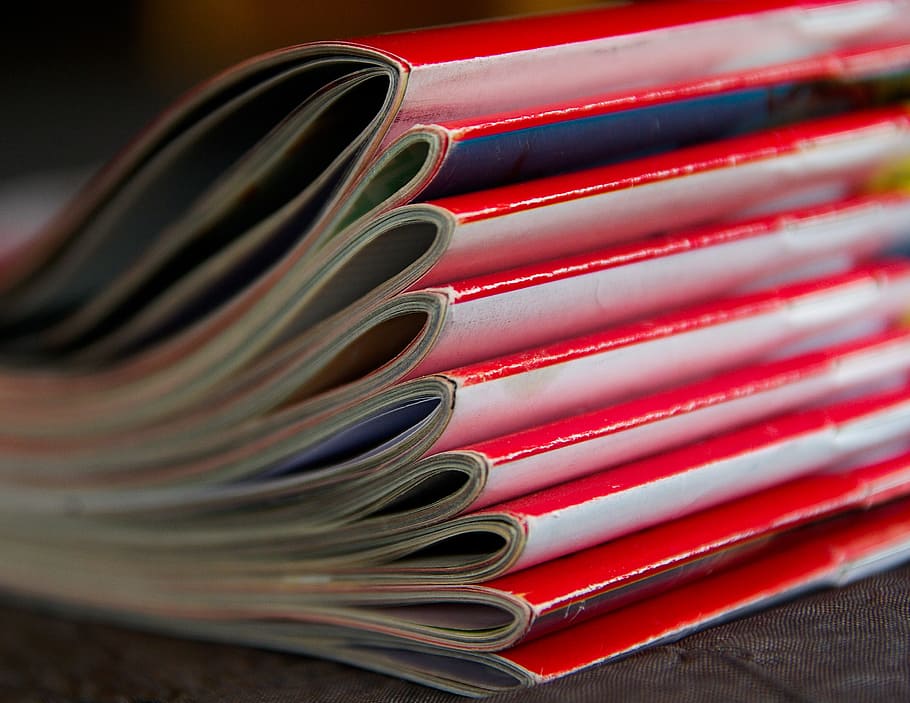 selective focus photography piled red magazine books, magazines HD wallpaper