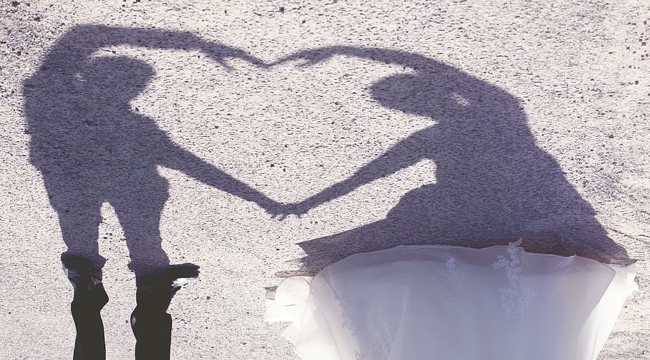 man and woman forming heart shadow, wedding, bride and groom
