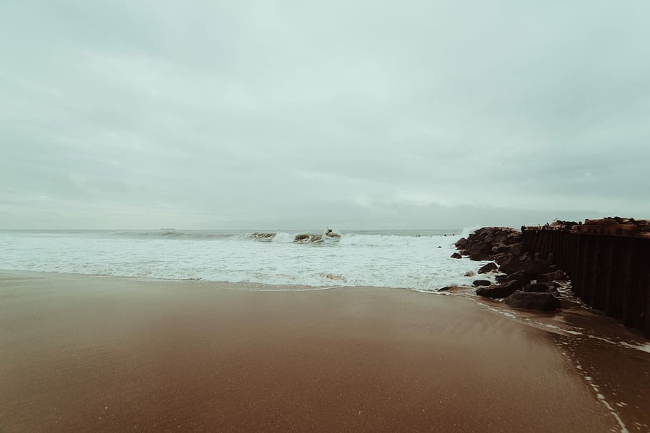 seashore view, beach, brown, clouds, cyan, gray, rocks, sand HD wallpaper