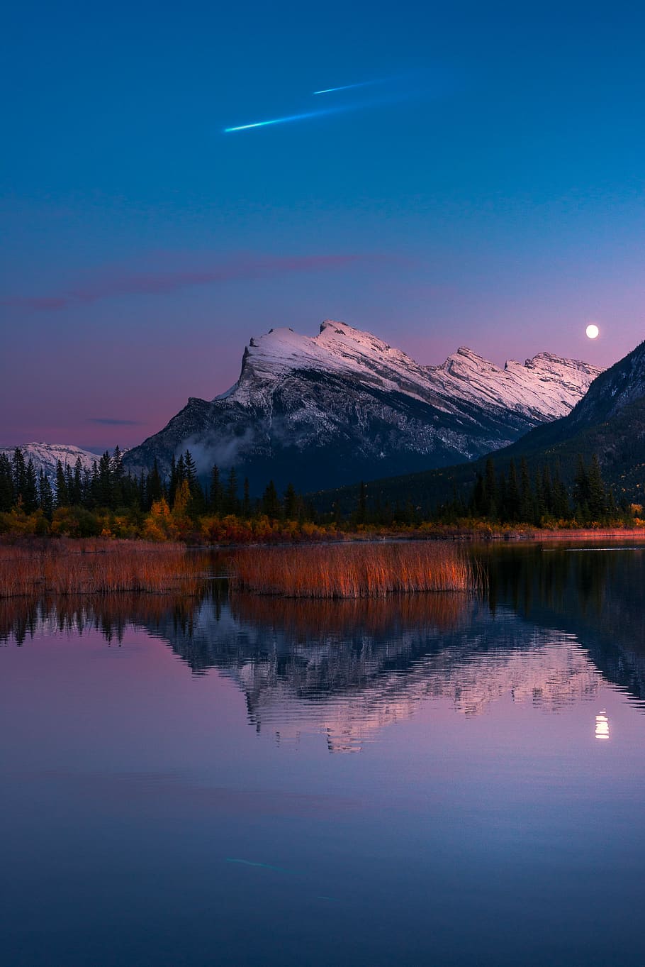 river beside mountain during golden hour, shooting star over mountain and body of water HD wallpaper