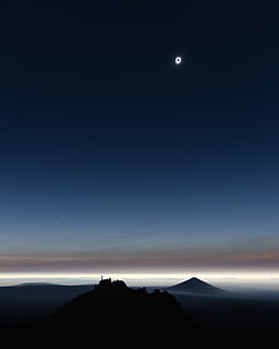 silhouette of castle during lunar eclipse, top view of mountain covered by clouds HD wallpaper